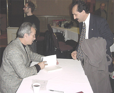 Joseph Gandeto Signing a Book for Tony Markovski